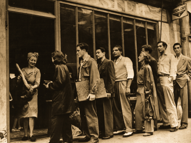 Richard, Herbert Gentry and Dan Kurzman on a bread line.